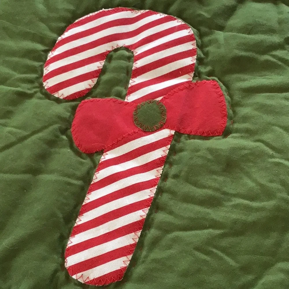 Handmade Christmas-themed applique quilt
